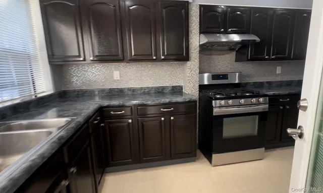 a kitchen with a stove and a microwave
