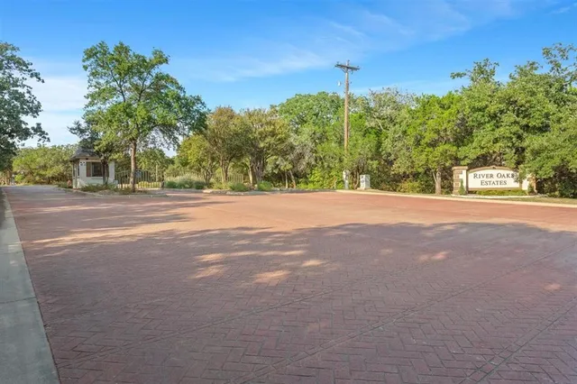 a view of a yard with a house in the background