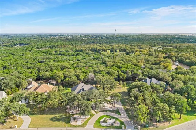 a view of a city with green space
