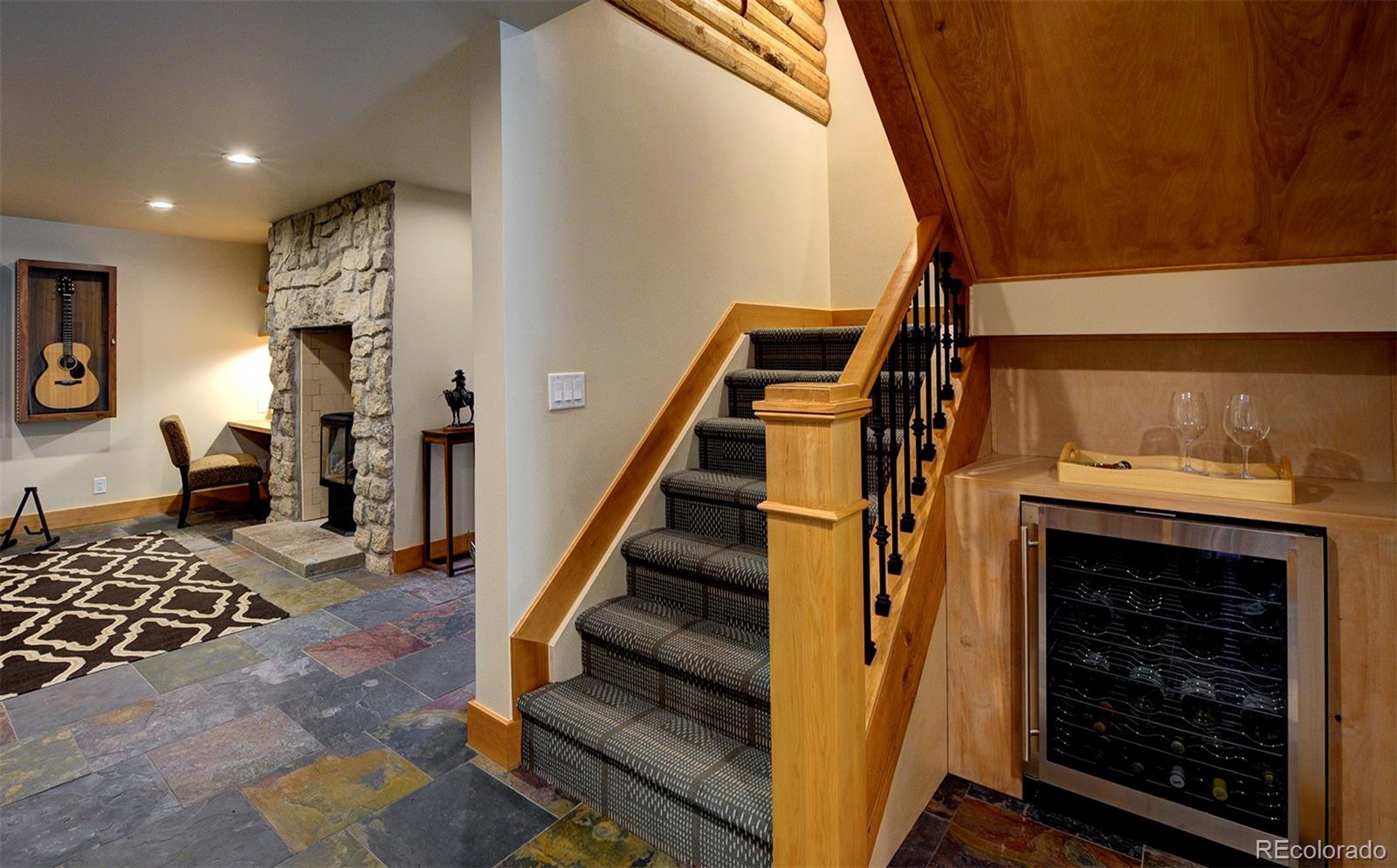 9670 South Warhawk Road Conifer, CO 80433 - Photo 16 of 40 a view of an entryway with wooden floor
