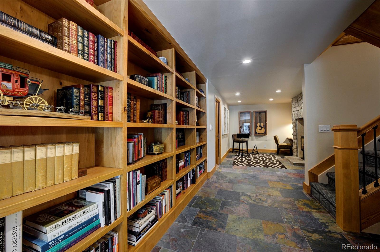 9670 South Warhawk Road Conifer, CO 80433 - Photo 17 of 40 a view of walk in closet with clothes and shoes