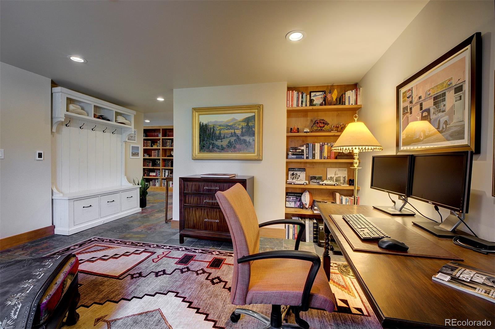 9670 South Warhawk Road Conifer, CO 80433 - Photo 18 of 40 a bedroom with a bed and furniture