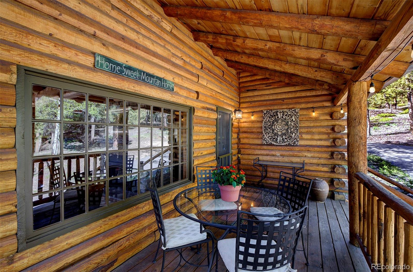 9670 South Warhawk Road Conifer, CO 80433 - Photo 4 of 40 a outdoor space with chairs
