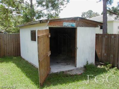 8382 Butternut Road Fort Myers, FL 33967 - Photo 3 of 10 a front view of a house with garden