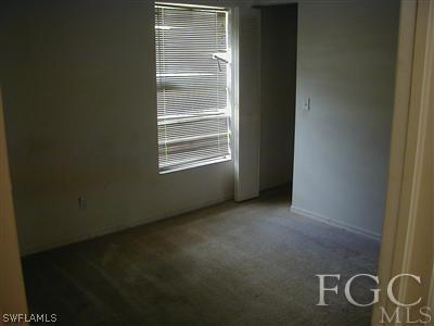 8382 Butternut Road Fort Myers, FL 33967 - Photo 4 of 10 a view of an empty room with windows