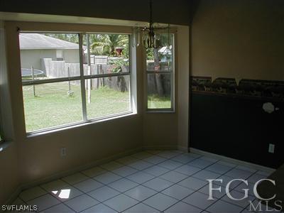 8382 Butternut Road Fort Myers, FL 33967 - Photo 8 of 10 a view of an empty room with a window