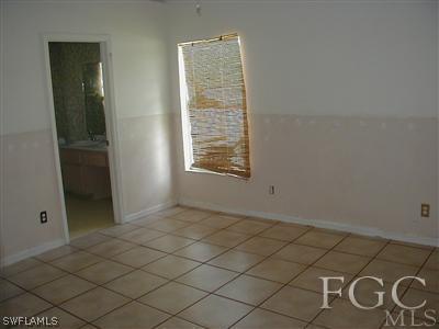 8382 Butternut Road Fort Myers, FL 33967 - Photo 10 of 10 an empty room with windows