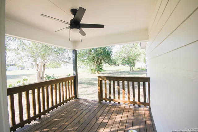 a view of a porch with wooden floor