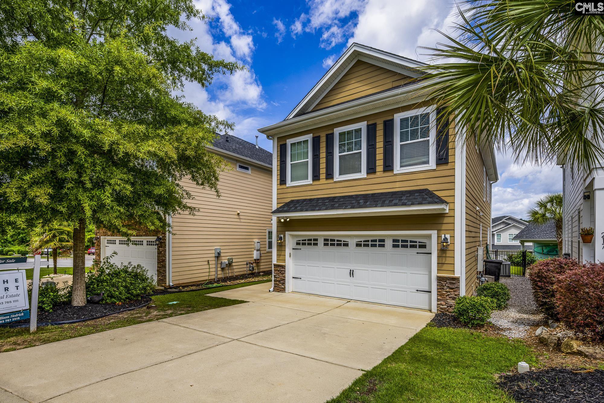 213 Sunset Point Drive Lexington, SC 29072 - Photo 2 of 35 a house view with a garden space