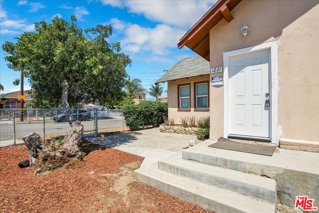 1221 West 152nd Street Compton, CA 90220 - Photo 2 of 20 a view of a house with backyard and sitting area