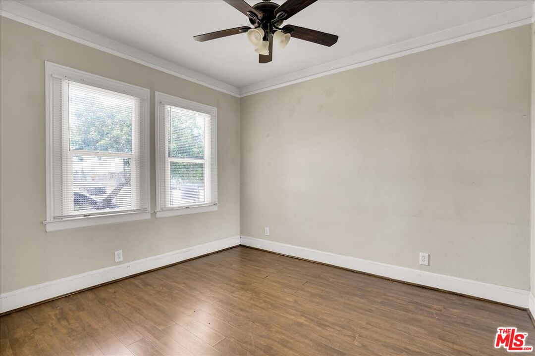 1221 West 152nd Street Compton, CA 90220 - Photo 10 of 20 wooden floor in an empty room with a window