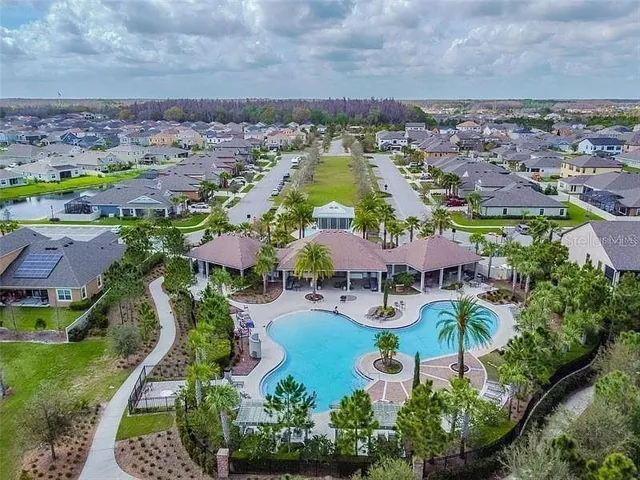 an aerial view of a house with outdoor space