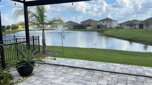 a view of a garden with a lake view