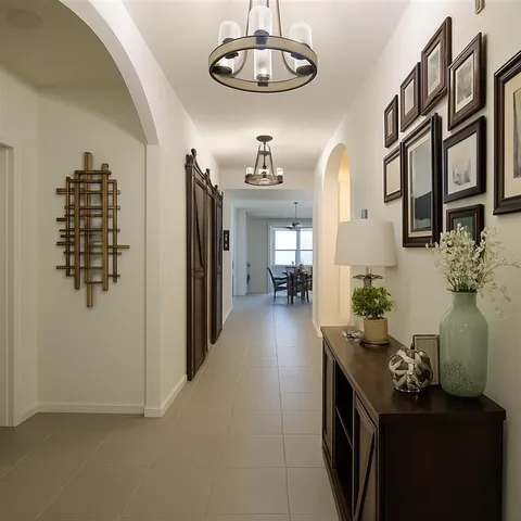 a view of a livingroom with furniture and entryway