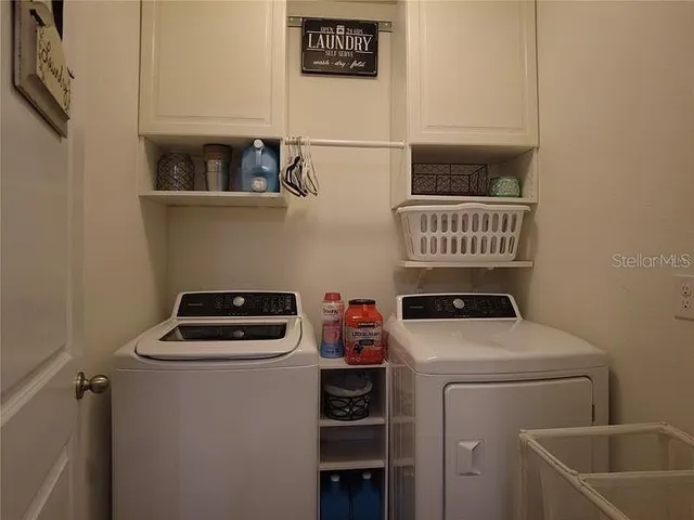 a utility room with dryer and washer