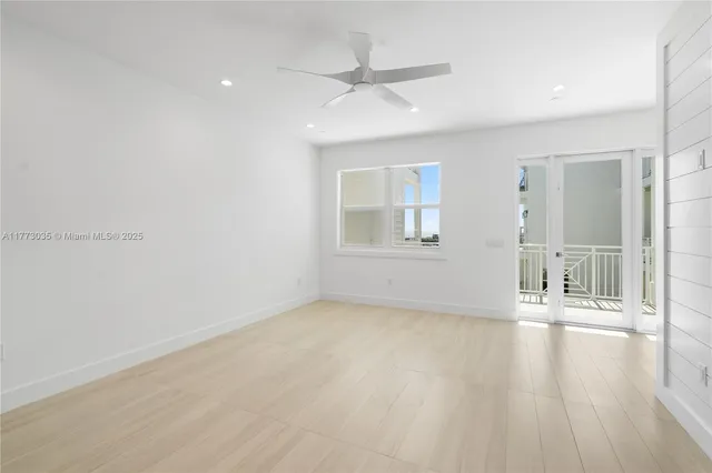 a view of kitchen and hall with wooden floor