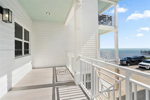 a bathroom with a sink toilet vanity and shower