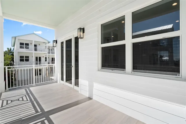 a view of a hallway with white walls