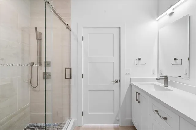 an aerial view of a house with a yard and lake view