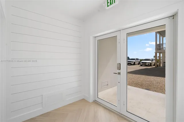 a kitchen with stainless steel appliances granite countertop a sink a stove and a wooden floors