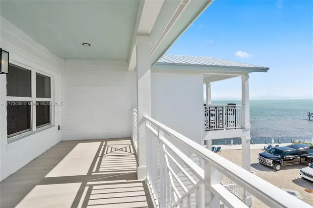 an aerial view of a house with a lake view