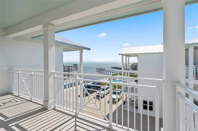a view of a house with a palm tree