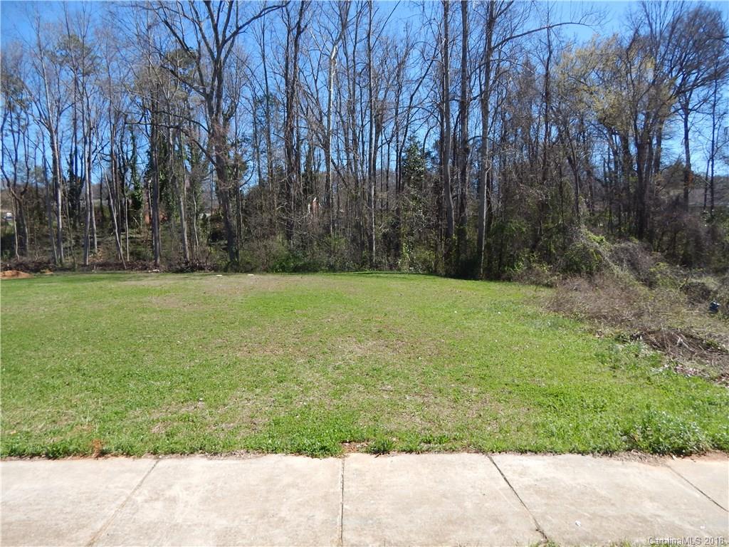 5040 Elizabeth Road Charlotte, NC 28269 - Photo 1 of 6 a view of a field with trees in the background