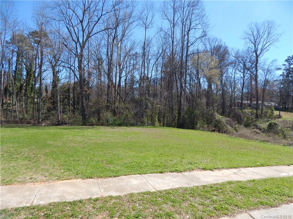 5040 Elizabeth Road Charlotte, NC 28269 - Photo 3 of 6 a view of a yard with a trees