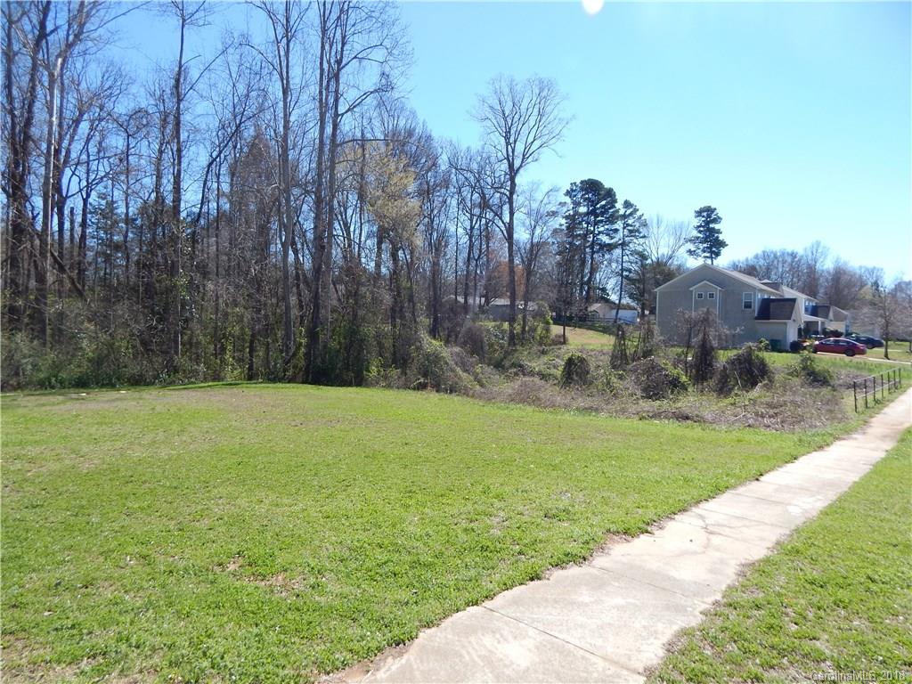 5040 Elizabeth Road Charlotte, NC 28269 - Photo 6 of 6 a backyard of a house with lots of green space