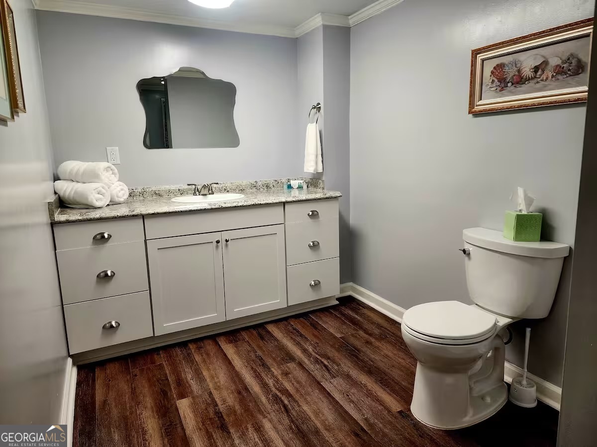 326 Turkey Run Dublin, GA 31021 - Photo 101 of 114 a bathroom with a toilet sink and mirror