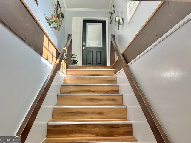 a view of a livingroom with furniture and a window
