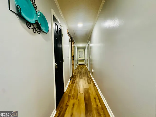 a view of a wooden deck with chairs and a yard