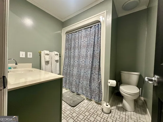 a kitchen with a table and chairs in it