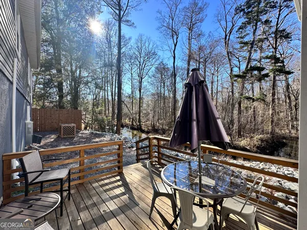 a kitchen with stainless steel appliances granite countertop a refrigerator stove a sink and a microwave