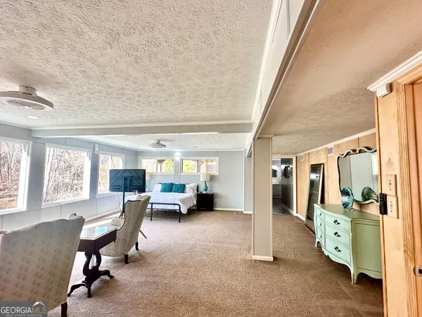 a dining room with furniture and window