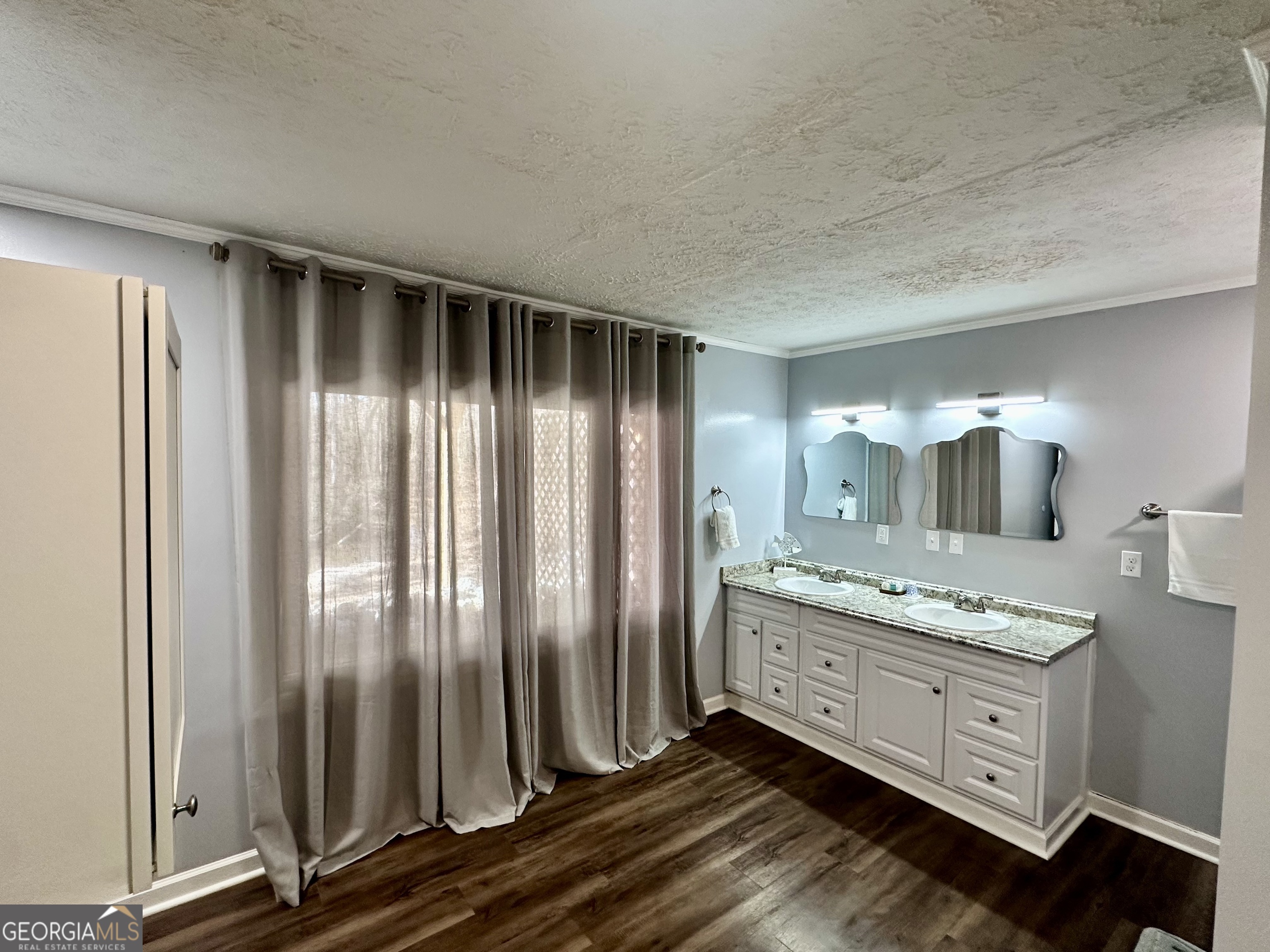 326 Turkey Run Dublin, GA 31021 - Photo 42 of 114 a bathroom with a granite countertop sink and a mirror