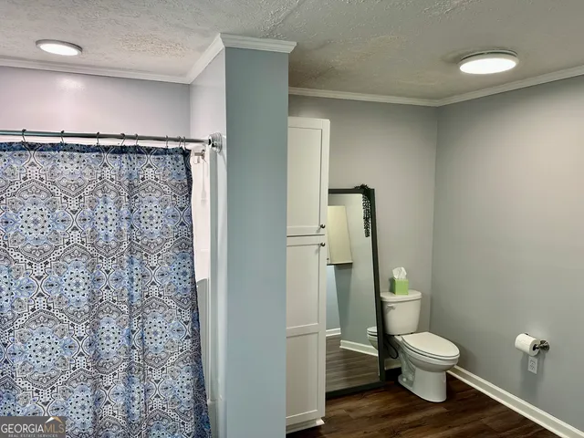 a bedroom with a bed and a lamp