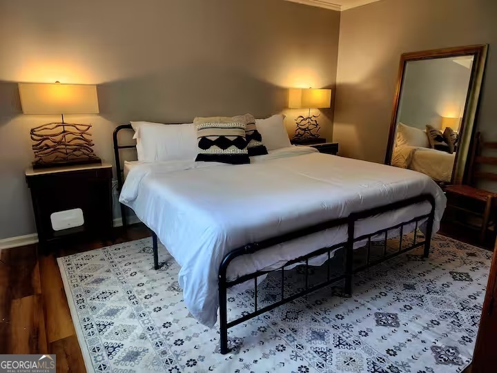 326 Turkey Run Dublin, GA 31021 - Photo 58 of 114 a bedroom with a bed and a mirror on dresser