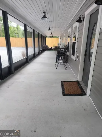 a living room with furniture a wooden floor and a fireplace