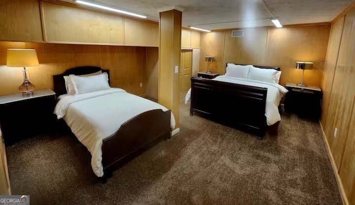 326 Turkey Run Dublin, GA 31021 - Photo 98 of 114 a bedroom with a bed and a night stand