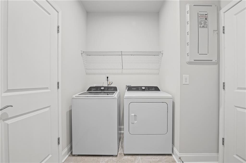 248 Nesta Grove Locust Grove, GA 30248 - Photo 24 of 40 a view of storage and utility room with washer and dryer