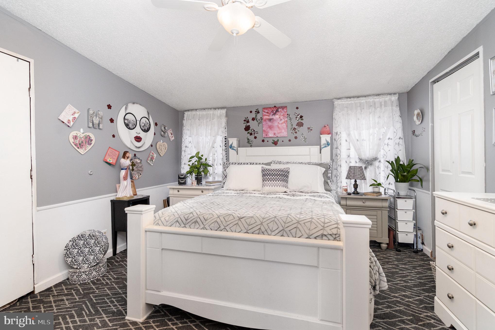 90 Penn Valley Village Lititz, PA 17543 - Photo 12 of 26 a bedroom with a bed and a chandelier