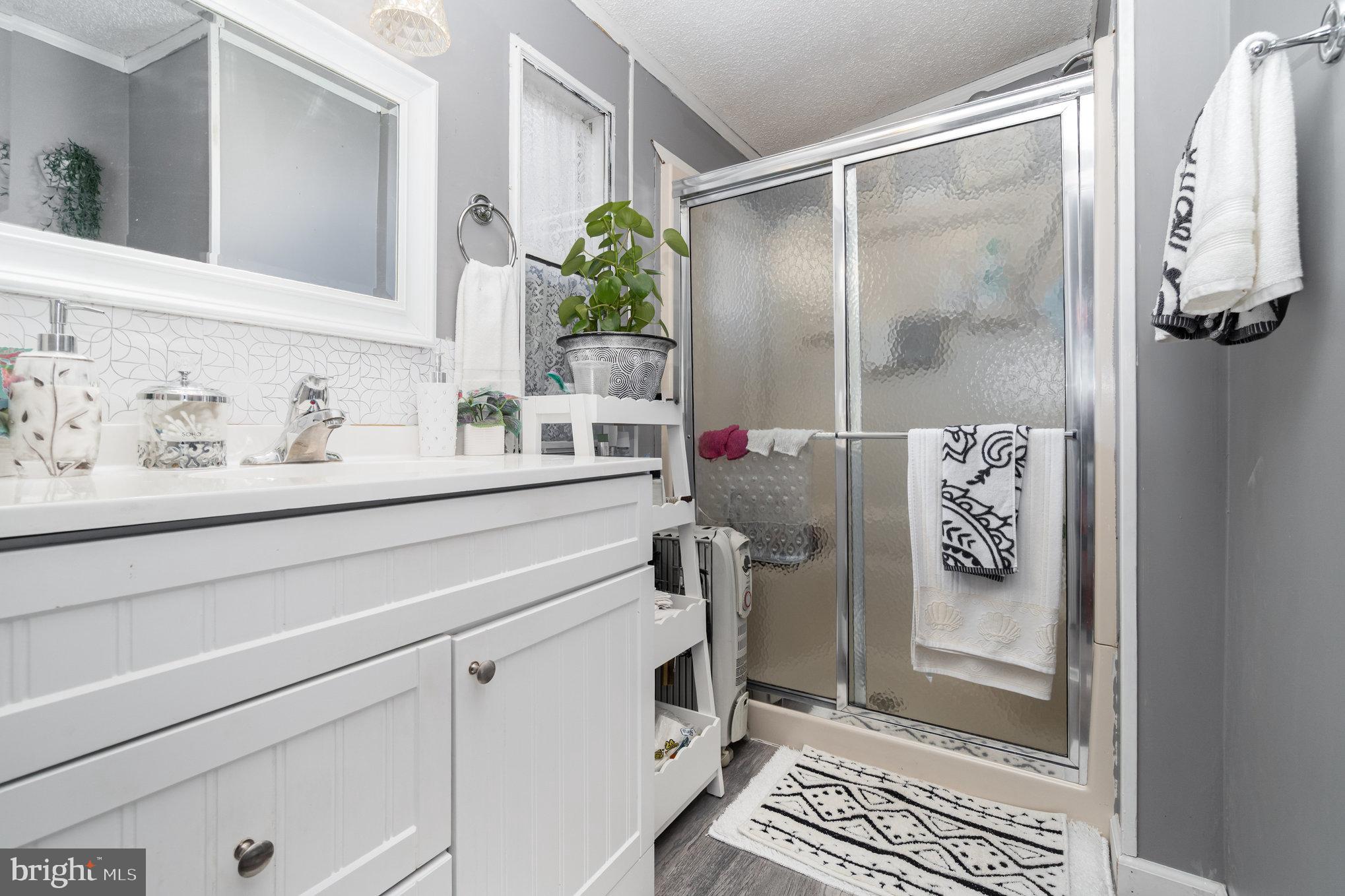 90 Penn Valley Village Lititz, PA 17543 - Photo 16 of 26 a bathroom with a shower and a sink
