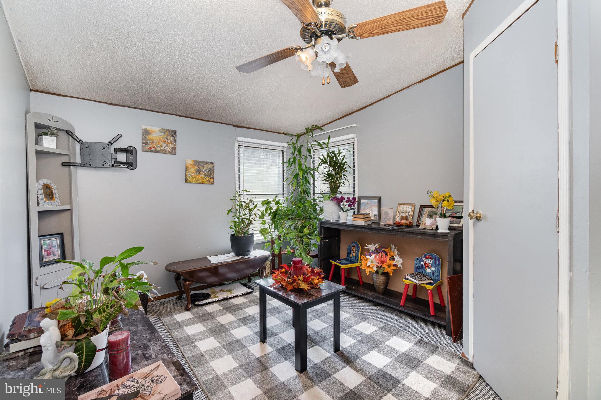 90 Penn Valley Village Lititz, PA 17543 - Photo 20 of 26 a living room with furniture and a potted plant