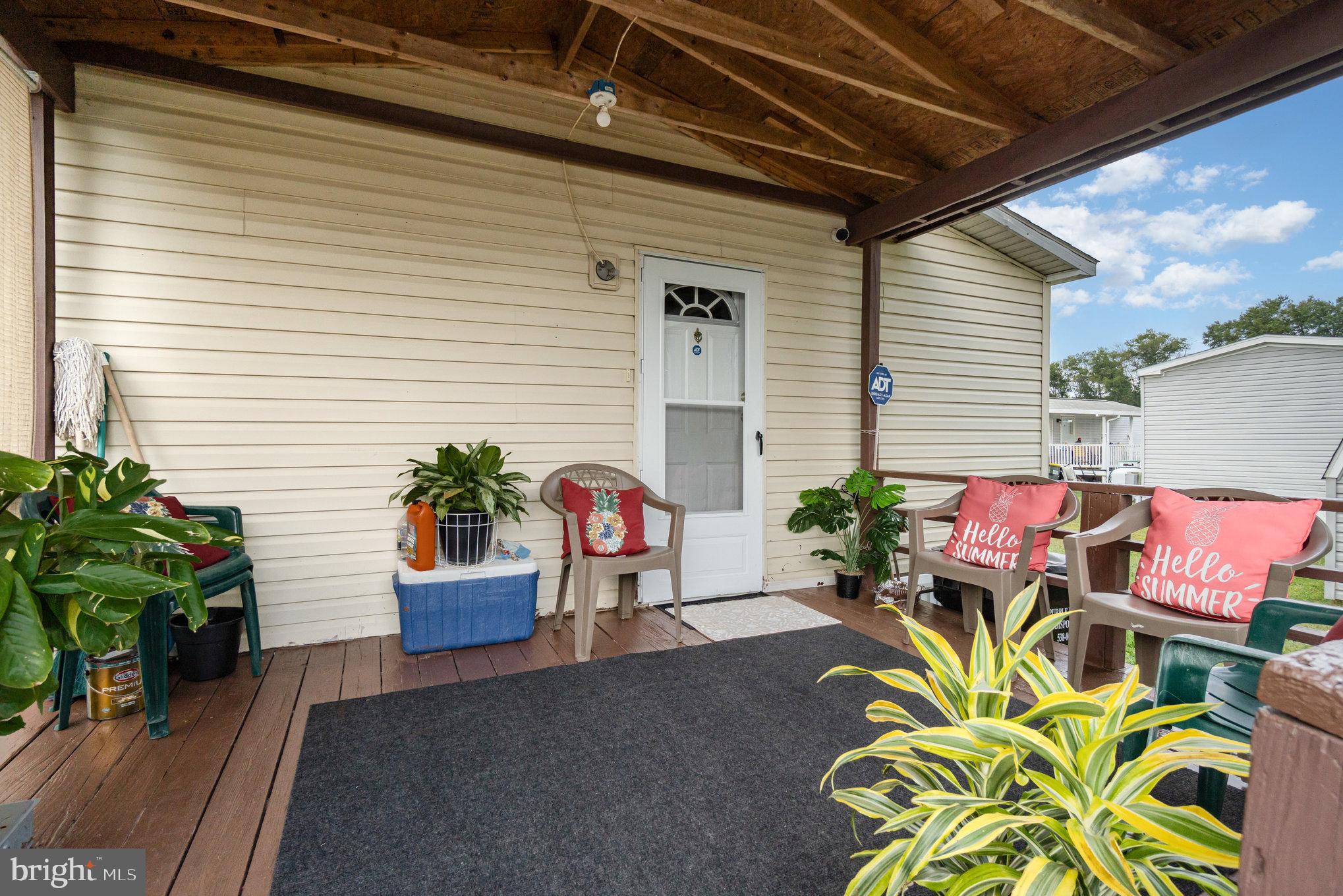 90 Penn Valley Village Lititz, PA 17543 - Photo 2 of 26 a potted plant sitting in front of a house
