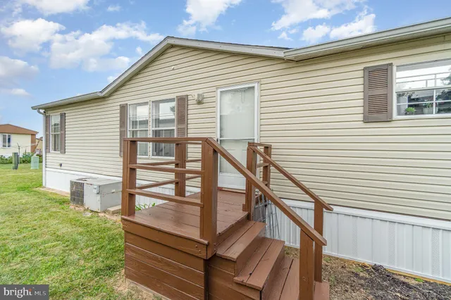a house that has a tree in front of it