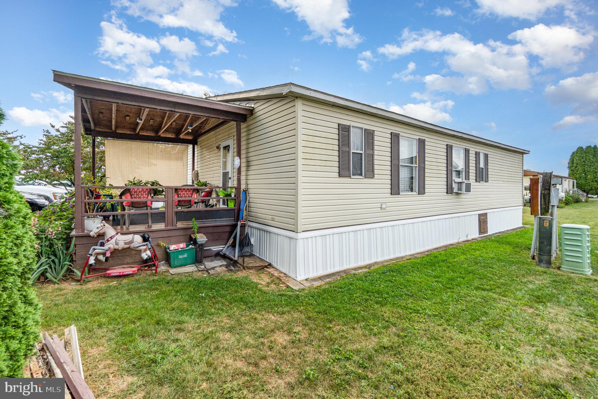90 Penn Valley Village Lititz, PA 17543 - Photo 26 of 26 a view of a chair and table in backyard of the house