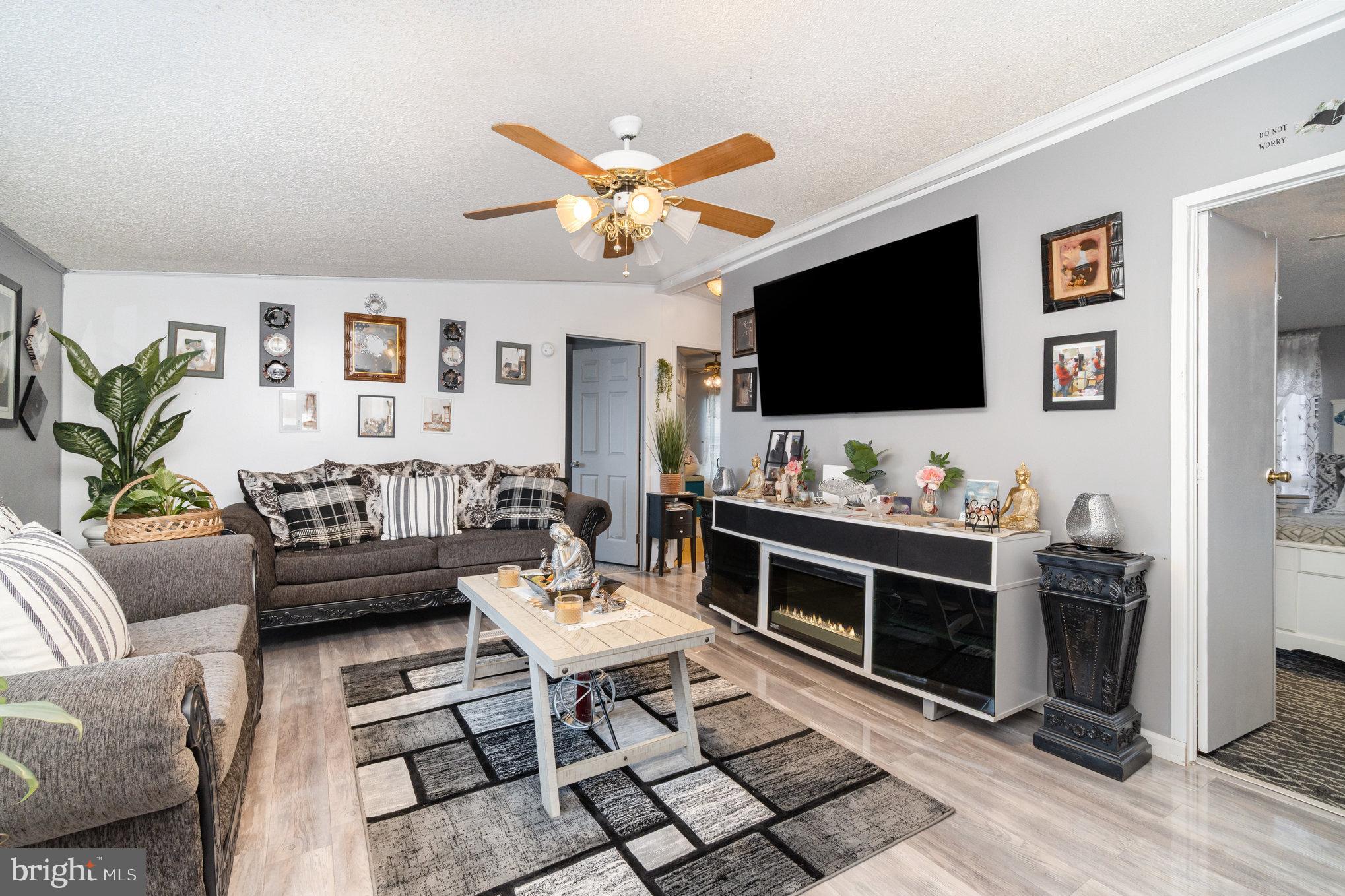 90 Penn Valley Village Lititz, PA 17543 - Photo 6 of 26 a living room with furniture and a flat screen tv