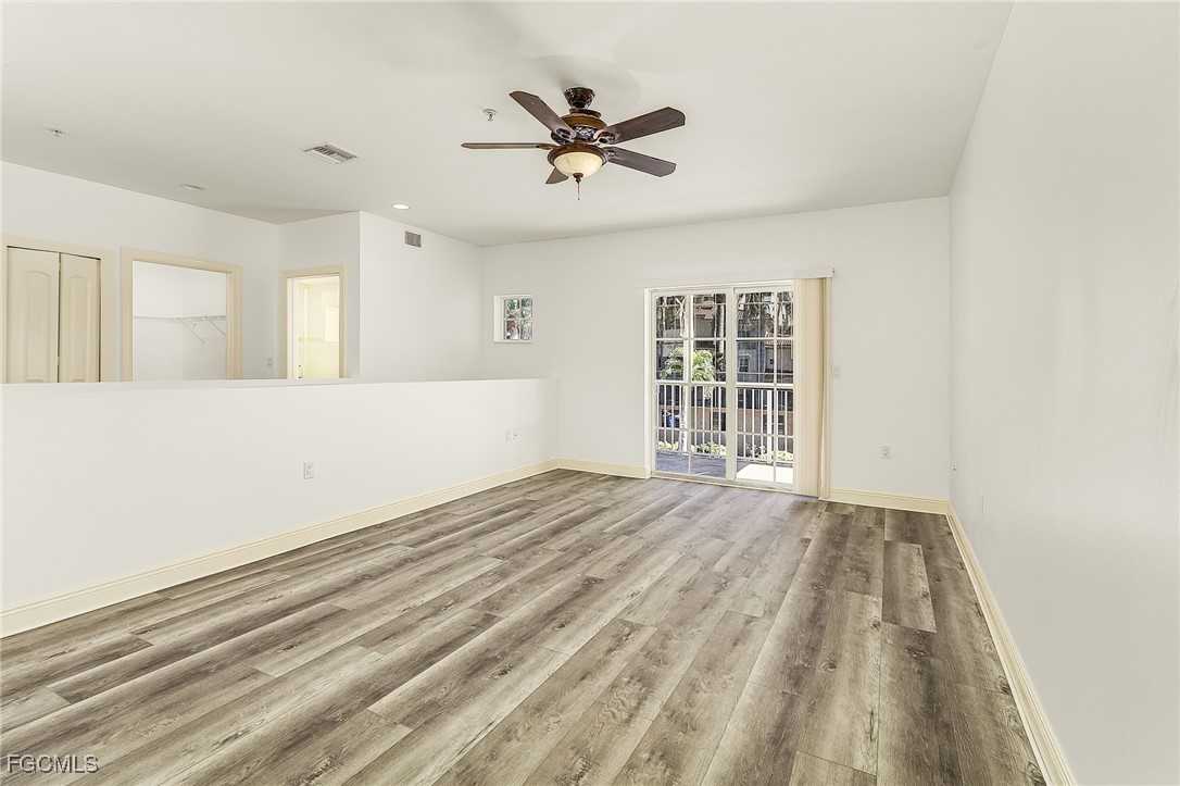 2110 West First Street, Unit 103 Fort Myers, FL 33901 - Photo 14 of 38 a view of an empty room with a window