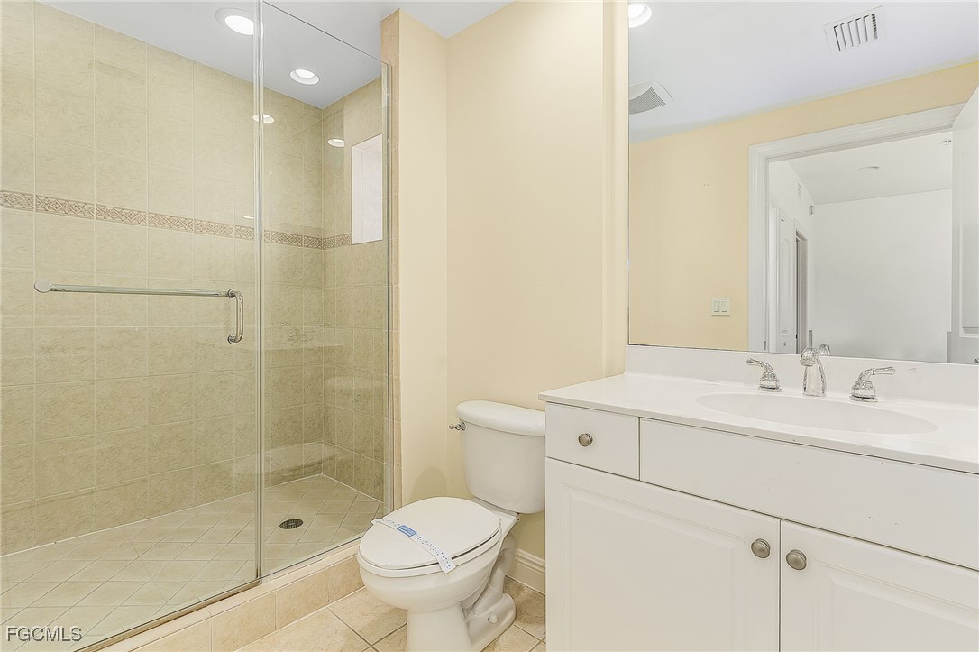 2110 West First Street, Unit 103 Fort Myers, FL 33901 - Photo 15 of 38 a bathroom with a sink a toilet and shower